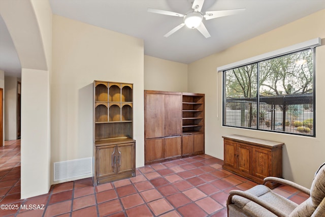 12431 E Cape Horn Dr, Tucson, AZ 85749 - sitting room with a ceiling fan, arched walkways, and tile patterned floors