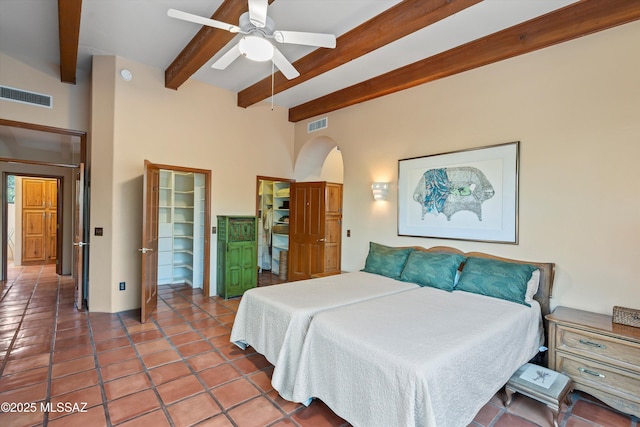 12431 E Cape Horn Dr, Tucson, AZ 85749 - bedroom with beamed ceiling, arched walkways, and ceiling fan