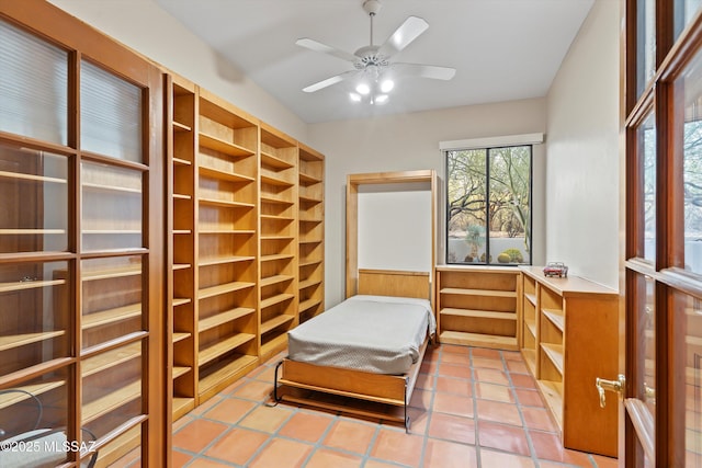 12431 E Cape Horn Dr, Tucson, AZ 85749 - bedroom featuring wainscoting and light tile patterned floors
