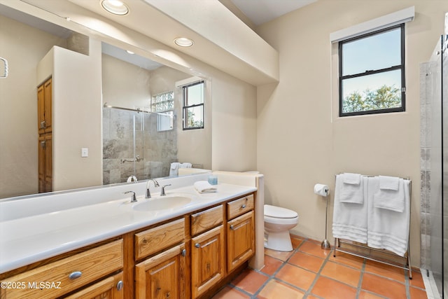 12431 E Cape Horn Dr, Tucson, AZ 85749 - full bathroom featuring toilet, vanity, a shower stall, recessed lighting, and tile patterned flooring