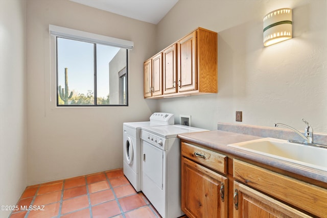 12431 E Cape Horn Dr, Tucson, AZ 85749 - washroom featuring cabinet space, washing machine and clothes dryer, and light tile patterned floors