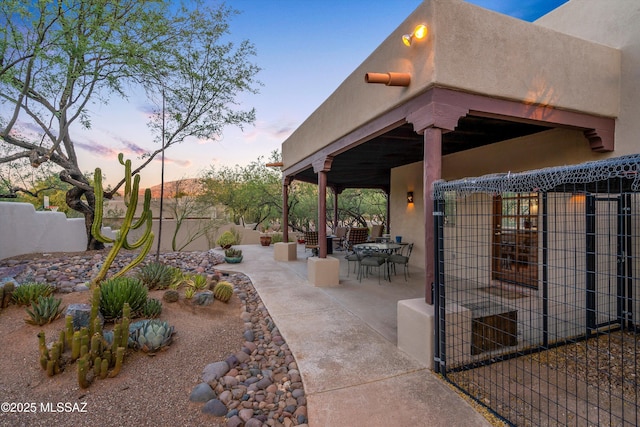 12431 E Cape Horn Dr, Tucson, AZ 85749 - patio terrace at dusk with a patio area