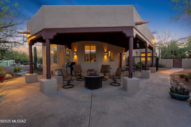 12431 E Cape Horn Dr, Tucson, AZ 85749 - view of patio / terrace featuring a gate and an outdoor fire pit