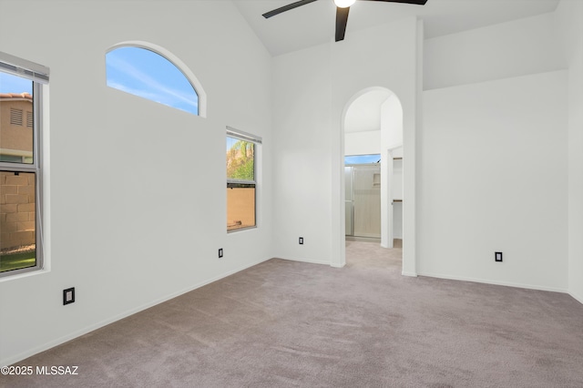 114 W Freddie Canyon Way, Oro Valley, AZ 85755 - spare room with baseboards, carpet, ceiling fan, and high vaulted ceiling