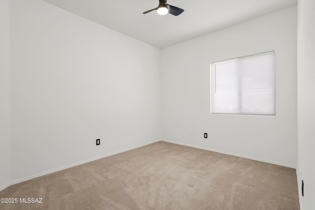 114 W Freddie Canyon Way, Oro Valley, AZ 85755 - spare room with carpet floors, a ceiling fan, and baseboards