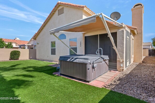 114 W Freddie Canyon Way, Oro Valley, AZ 85755 - rear view of house featuring fence, stucco siding, a sunroom, a hot tub, and a yard