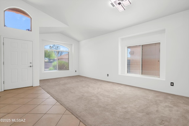114 W Freddie Canyon Way, Oro Valley, AZ 85755 - interior space with light colored carpet, light tile patterned floors, and vaulted ceiling