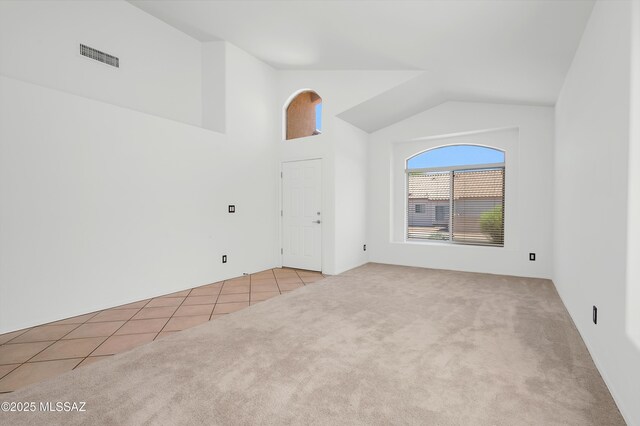 114 W Freddie Canyon Way, Oro Valley, AZ 85755 - carpeted empty room with high vaulted ceiling, tile patterned flooring, and visible vents