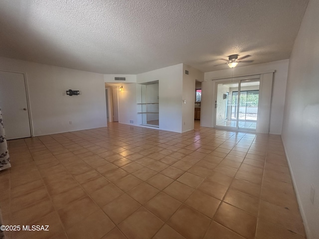 334 S Las Hamacas, Green Valley, AZ 85614 - empty room featuring a textured ceiling, ceiling fan, and light tile patterned floors