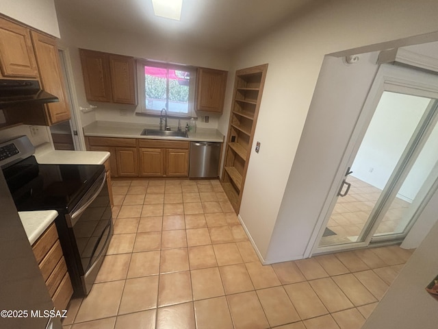 334 S Las Hamacas, Green Valley, AZ 85614 - kitchen featuring stainless steel appliances, a sink, exhaust hood, light countertops, and light tile patterned floors