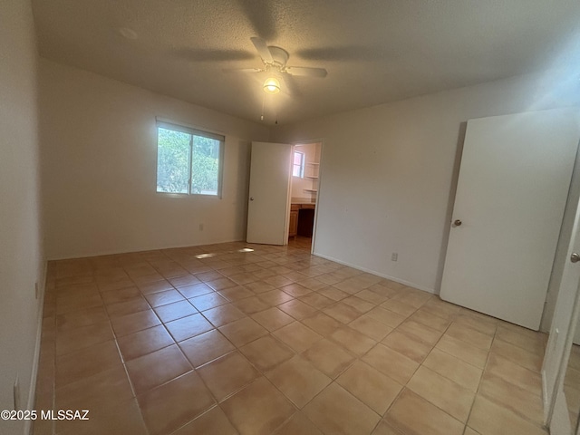 334 S Las Hamacas, Green Valley, AZ 85614 - empty room featuring ceiling fan and light tile patterned flooring