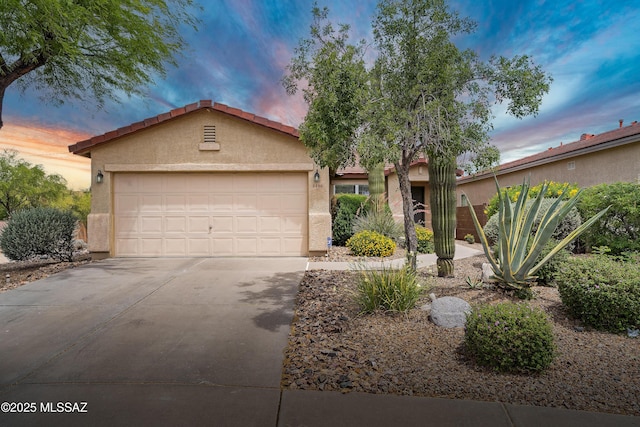 3486 W Sagebrush Hills Ct, Tucson, AZ 85741 - view of front of house featuring stucco siding, an attached garage, and concrete driveway