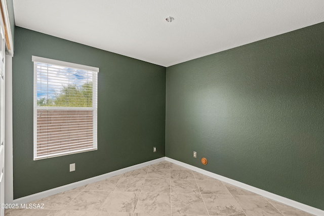 3486 W Sagebrush Hills Ct, Tucson, AZ 85741 - spare room featuring baseboards