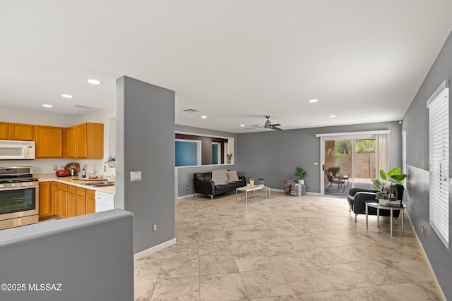 3486 W Sagebrush Hills Ct, Tucson, AZ 85741 - living room featuring baseboards, recessed lighting, and a ceiling fan