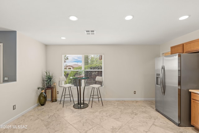 3486 W Sagebrush Hills Ct, Tucson, AZ 85741 - kitchen with stainless steel fridge with ice dispenser, recessed lighting, and baseboards