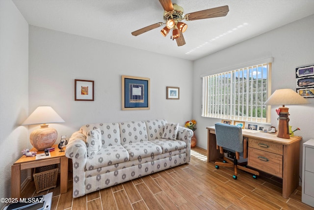 office area featuring a ceiling fan and wood finished floors