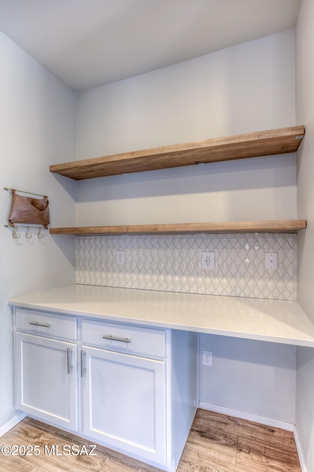 14172 E Vardo Dr, Vail, AZ 85641 - detailed view of backsplash, wood finished floors, and baseboards