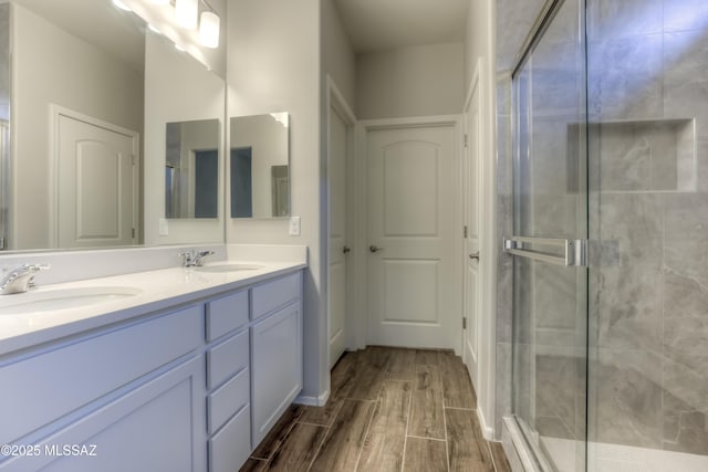 14172 E Vardo Dr, Vail, AZ 85641 - full bath featuring double vanity, a shower stall, and wood finished floors