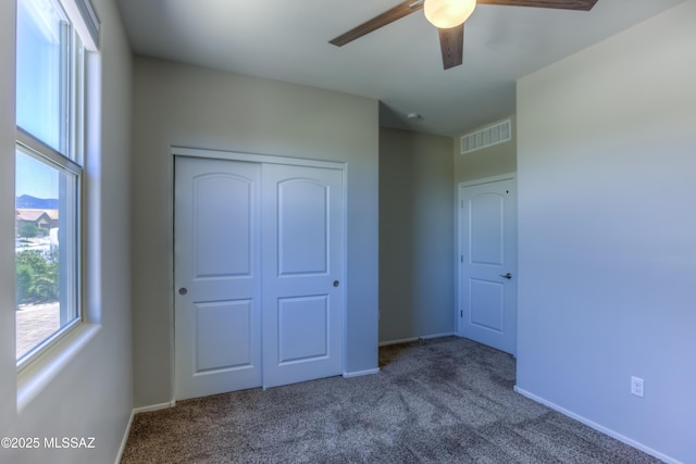 14172 E Vardo Dr, Vail, AZ 85641 - unfurnished bedroom with carpet, a closet, baseboards, and a ceiling fan