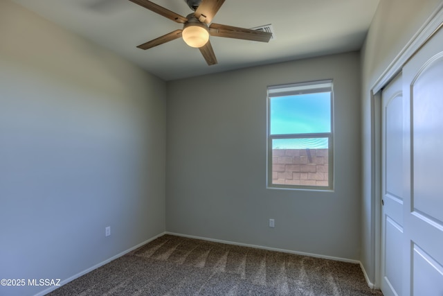 14172 E Vardo Dr, Vail, AZ 85641 - unfurnished bedroom featuring dark carpet, baseboards, a closet, and a ceiling fan