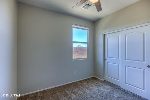 14172 E Vardo Dr, Vail, AZ 85641 - unfurnished bedroom with dark carpet, baseboards, a closet, and ceiling fan