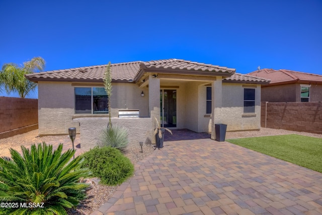14172 E Vardo Dr, Vail, AZ 85641 - view of front of house featuring a fenced backyard, a patio, stucco siding, and a tile roof