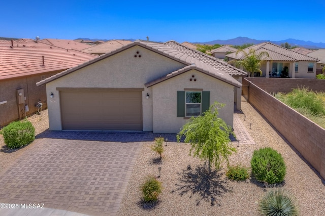 14172 E Vardo Dr, Vail, AZ 85641 - mediterranean / spanish-style house featuring stucco siding, an attached garage, a tile roof, a mountain view, and driveway