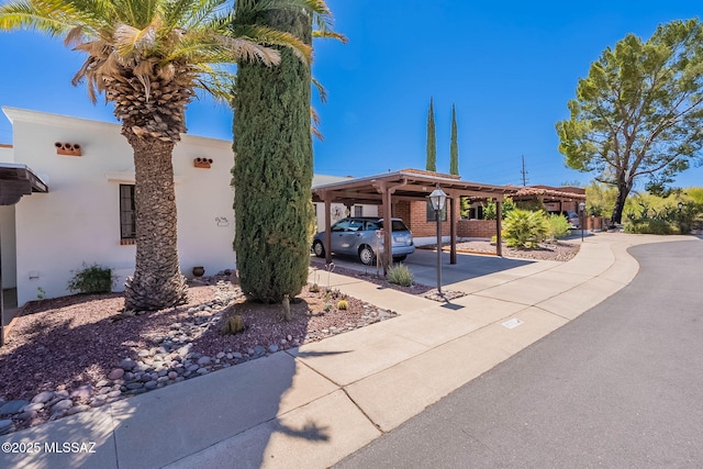 view of front of home with a carport