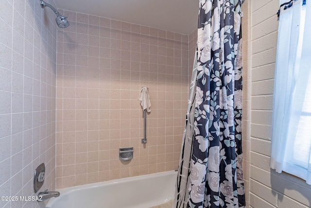 bathroom featuring shower / tub combo with curtain