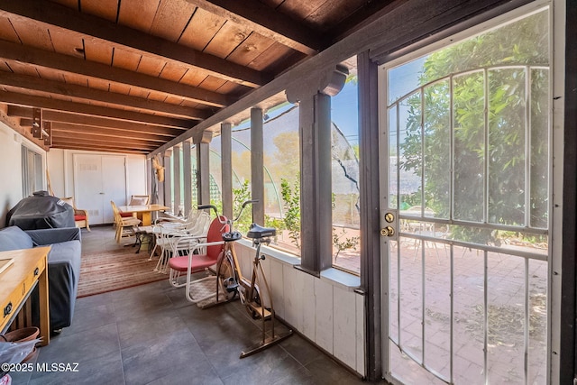 sunroom / solarium with beamed ceiling