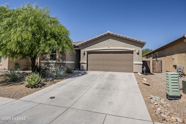 15726 S Camino Oculi, Sahuarita, AZ 85629 - single story home featuring stucco siding, a tiled roof, driveway, and a garage