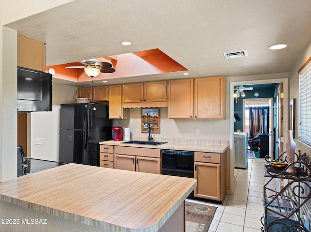 kitchen featuring a ceiling fan, a sink, light tile patterned flooring, and black appliances