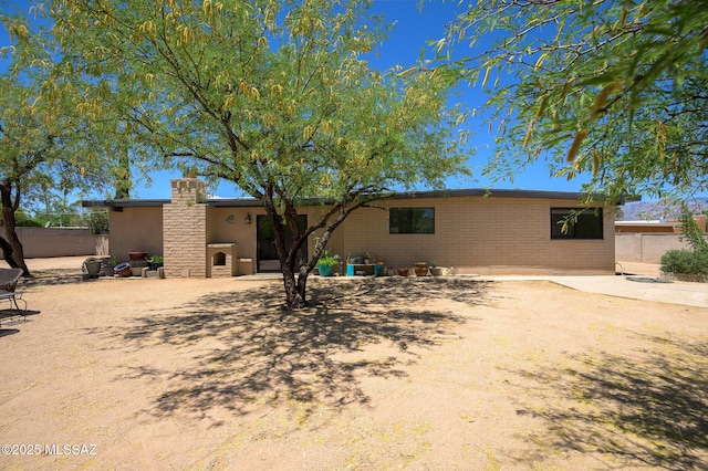 view of front of property featuring brick siding