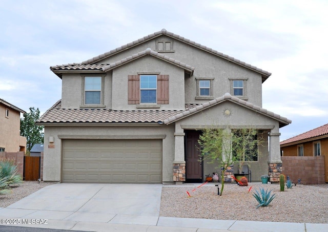 traditional-style house featuring driveway, a tile roof, a garage, fence, and stucco siding