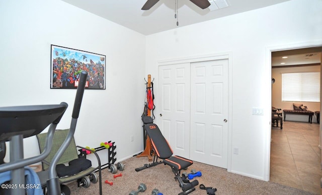 workout area featuring a ceiling fan, baseboards, and visible vents