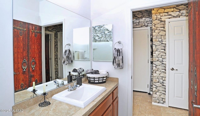 bathroom featuring tile patterned floors and vanity