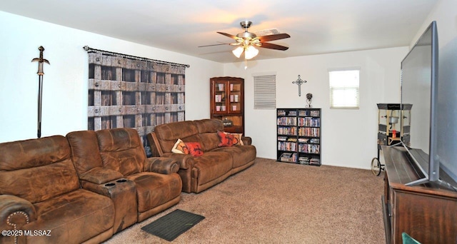 carpeted living room featuring ceiling fan