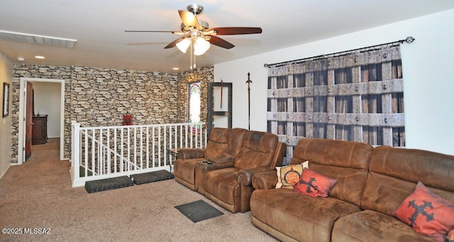 carpeted living room featuring visible vents and ceiling fan