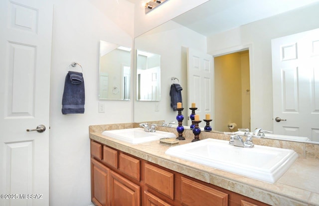 full bathroom featuring a sink and double vanity
