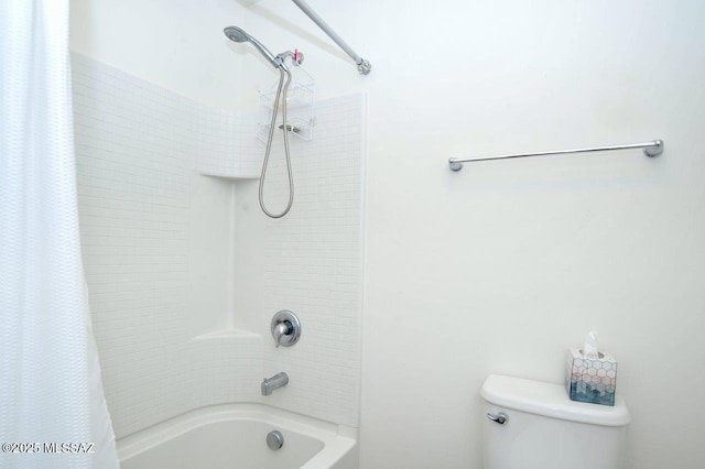 bathroom with toilet and shower / bath combo