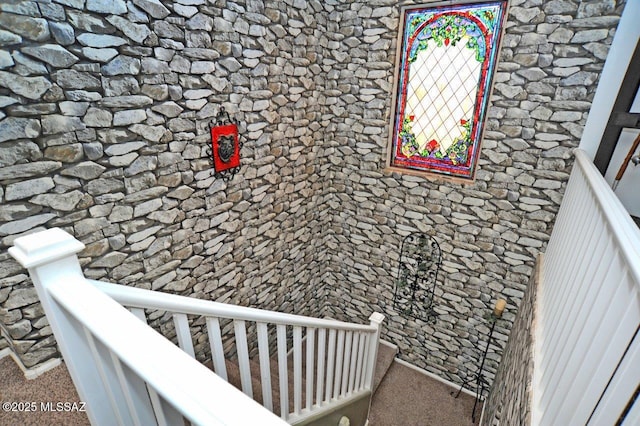 stairs featuring carpet