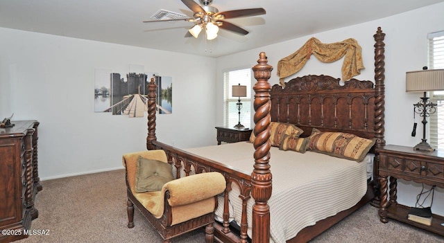 carpeted bedroom with ceiling fan, visible vents, multiple windows, and baseboards