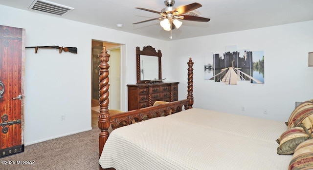 carpeted bedroom with visible vents and a ceiling fan