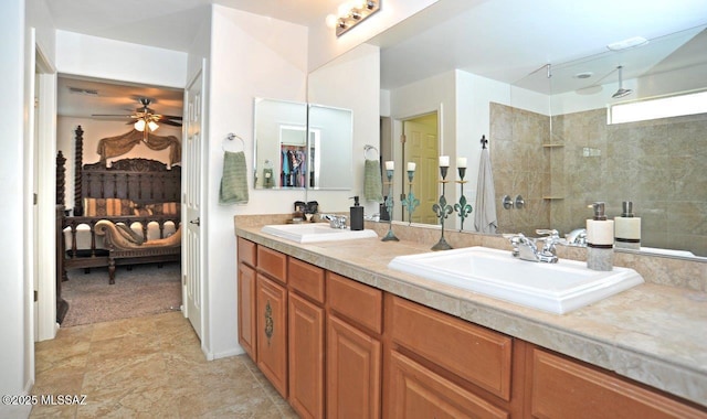 full bathroom with a sink, ceiling fan, walk in shower, and double vanity