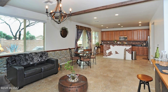 living room with light tile patterned floors, recessed lighting, a chandelier, and visible vents