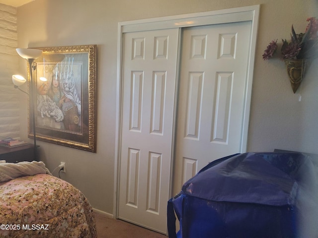 carpeted bedroom featuring a closet