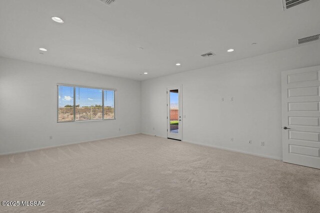 7956 S Desert Indigo Dr, Tucson, AZ 85747 - empty room with recessed lighting and light carpet