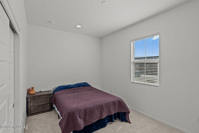 bedroom with carpet flooring and baseboards