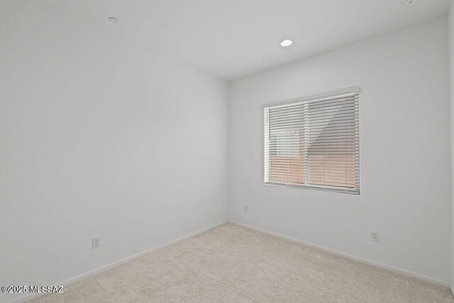 7956 S Desert Indigo Dr, Tucson, AZ 85747 - carpeted empty room with baseboards and recessed lighting