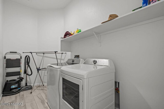 7956 S Desert Indigo Dr, Tucson, AZ 85747 - laundry room featuring washing machine and clothes dryer and baseboards